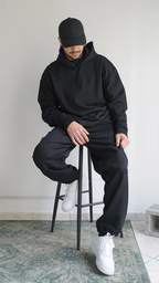 Sweatpants oversize unisex a vita media in cotone con logo ricamato nero sul davanti Empyrom